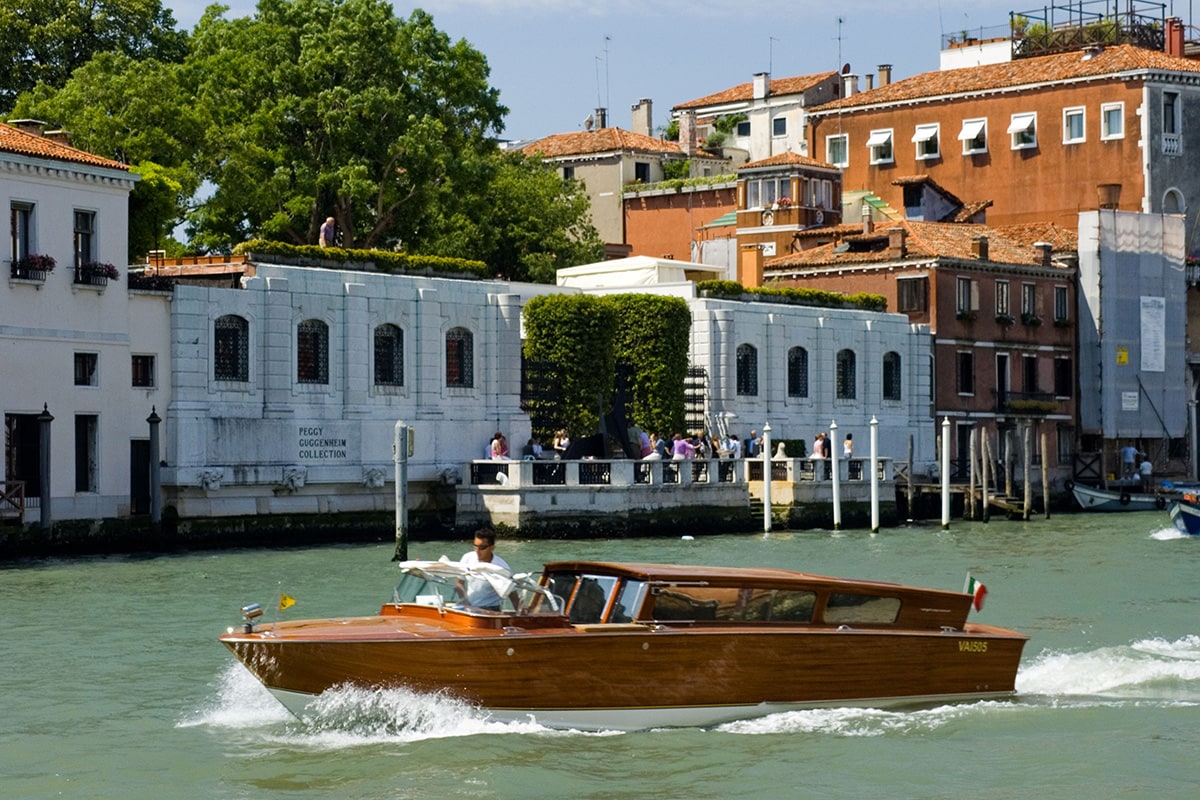 Luxury boat cruising through the waters of Venice