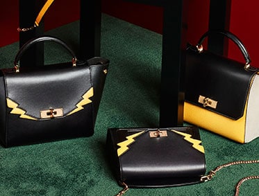 The yellow leather B-Turn minibag with a chain and leather strap – a perfect Bally gift